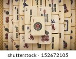 Small photo of Old chinese game mahjongg on bamboo mat background