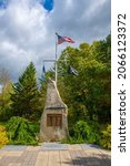 Small photo of USS Thresher SSN 593 memorial with US National Flag in town of Kittery, Maine ME, USA. USS Thresher submarine sank in 1963 and killing all 129 crew.