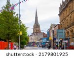 Small photo of PRESTON, UK - JUN. 17, 2022: Historic building on Church Street and Preston Minster church in historic city centre of Preston, Lancashire, UK.
