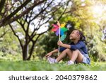 happy asian little girl playing ... | Shutterstock . vector #2040379862