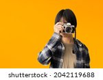 asian teen girl photographer... | Shutterstock . vector #2042119688