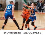 Small photo of POLKOWICE, POLAND - OCTOBER 27, 2021: Baskteball match EuroCup Women between BC Polkowice - WBC Enisey Krasnojarsk. In action Feyonda Fitzgerald (M) and Alisa Latsgal (R).