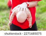 Small photo of Using the Heimlich Maneuver on choking baby or child