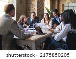 Small photo of Group of multiethnic businesspeople working on financial strategy, renewable power, sustainable innovation project and environmental economical issues - business and sustainability concept
