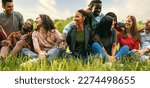 Small photo of A joyful and diverse group of friends, including students and international travelers, engage in outdoor activities and relaxation in a vibrant city park. - diversity, inclusion, friendship concepts