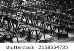 Small photo of empty chairs without people in the church a symptom of a profound religious crisis that distances the faithful from places of worship in black and white effect