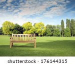 Garden Bench In Park With Trees