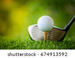 teeing off with golf club and golf ball
