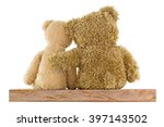 Back of a couple of cute brown bears sitting on wood with big one hugging little girl isolated on white background