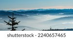 Small photo of View to Nizke Tatry mountains with nearer Beskid Zywiecki, Oravska Magura and Velky Choc in Slovakia from Magurka Wislanska hill in Beskid Slaski mountains in Poland during amazing winter day