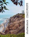La Marina Lighthouse on a hill in the Miraflores area of Lima, Peru. Cityscape with ocean.