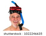 Small photo of A sprightly senior with snorkel and scuba mask laughs heartily into the camera and is looking forward to his beach holiday.
