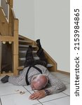 Small photo of A senior fell on the stairs at home. Most falls happen at home. Almost every week at least one senior has a fatal accident as a result of falling down stairs.