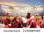 Small photo of Poland football supporter on stadium. Polish fans on soccer pitch watching team play. Group of supporters with flag and national jersey cheering for Poland. Championship game.