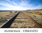 Steel Railroad Tracks Lead Into ...