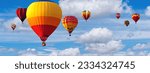 Small photo of Hot Air Balloon Ride in blue sky white clouds background for wide banner of travel agency or adventure tour. Romance of ballooning in a good weather. Hot air balloons flies in blue sky. Copy space