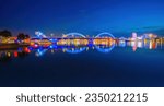 Small photo of Panorama of Dragon River Bridge ( Rong Bridge) and administrative center building at night, the symbol of Da Nang city, Vietnam. Da Nang is the most livable tourist city in Vietnam