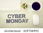 Cyber Monday message with workstation on a light green wooden desk