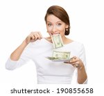 Small photo of Closeup portrait greedy, young ceo, corporate executive, business woman, manager eating green cash, money dollars from plate, isolated white background. Emotion, facial expression. Financial avarice.