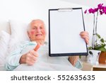 Happy Elderly Woman Holding Her ...