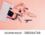 Make up bag with cosmetics isolated on pink background