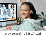 Small photo of Teenage mixed race girl high school student distance e learning group online class at home looking at camera. Video conference call remote class, course, virtual digital education, headshot portrait.