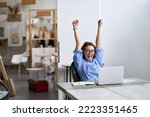 Small photo of Happy excited young woman student or employee, office worker winner using laptop computer celebrating goal achievement winning online getting good news in email raising hands feeling euphoric.