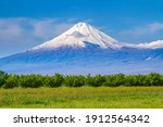Small photo of Mount Ararat (Turkey) at 5,137 m viewed from Yerevan, Armenia. This snow-capped dormant compound volcano consists of two major volcanic cones described in the Bible as the resting place of Noah's Ark.