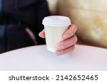 paper coffee cup in a male hand.... | Shutterstock . vector #2142652465