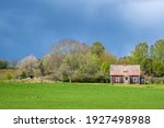 Old Farmhouse At A Field With...