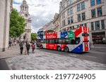 Small photo of London, UK - August 21, 2022: Toot Bus, London touring bus outside St Pauls Cathedral in London.