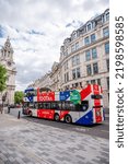 Small photo of London, UK - August 21, 2022: Toot Bus, London touring bus outside St Pauls Cathedral in London.