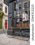 Small photo of London, UK - July 18, 2023: Antique bicycle outside Thomas Farthing building on Museum Street