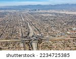 Aerial view of highway interchange Harbor and Century Freeway traffic with downtown city Los Angeles, USA