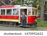 Small photo of PRAGUE, CZECH REPUBLIC - May 25, 2019: Tourist tram on the streets of the city. Ticket collector.