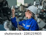 Small photo of woman engineer in uniform helmet inspection check control heavy machine robot arm construction installation in industrial factory. technician worker check for repair maintenance electronic operation