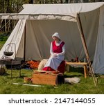 Small photo of Henham, Suffolk, UK - April 17 2022. Lady dressed as an authentic wench at a medieval display, Henham Easter Country Show April 2022