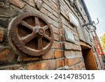 Small photo of Metal rusted ankra protects house from damage on wobbly post-mining land, Katowice, Silesia, Poland