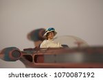 Small photo of APR 15 2018: Recreation of a scene from Star Wars Episode IV A New Hope of Luke Skywalker and his X-34 Landspeeder on Tattooine - Hasbro Black Series 6 inch action figure