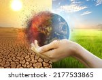 Small photo of Hand of young man hold world globe with burn hot by drought environment and beautiful green abundance nature metaphor Climate change. Elements of this image furnished by NASA