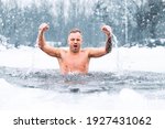 Man winter swimming in ice cold water