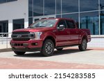 Small photo of Fishers - Circa May 2022: Ford F-150 display at a dealership. The Ford F150 is available in XL, XLT, Lariat, King Ranch, Platinum, and Limited models.
