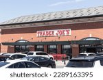 Small photo of Indianapolis - Circa April 2023: Trader Joe's retail location. Trader Joe's is a chain of specialty grocery stores.