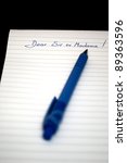 Small photo of Dear sir or Madame written on a notebook with pen