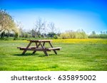 Picnic Table On A Green Meadow...