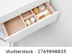 Free Image of Wooden chest of drawers with open drawer