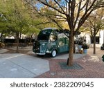 Small photo of Charlotte, NC - October 30, 2023: Ralph's Ralph Lauren coffee truck decorated for the holidays in Phillips Place in Charlotte, NC