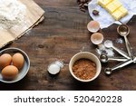 Baking Ingredients for a chocolate cake or brownie on a rustic wooden background 