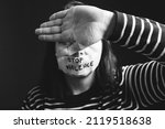 Small photo of Women violence and abused concept. Stop domestic violence against women and human trafficking.Woman with tape on mouth and stop violence text