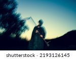 Small photo of grim reaper, the death itself, scary horror shot of Grim Reaper holding scythe